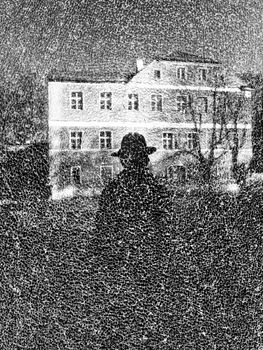 Mysterious silhouette of a person in front of an old building in Lower Silesian, Poland.