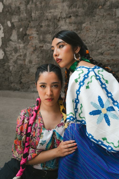 Free Two women in traditional clothing in León, Guanajuato showcasing vibrant Mexican fashion. Stock Photo
