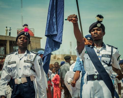 Free Nigerian cadets proudly marching in uniform during a ceremony in Zaria City, Nigeria. Stock Photo