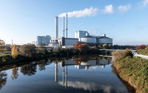 Free Tranquil industrial scene with factory reflection in water, Hamburg. Stock Photo