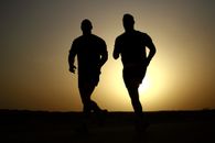 Silhouette of Two Man Running