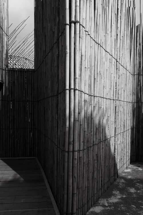 Free Artistic black and white photo of modern bamboo wall exterior structure. Stock Photo
