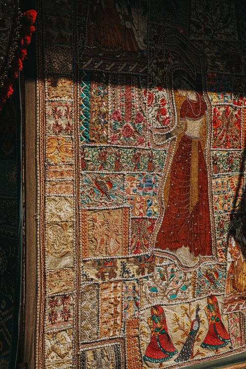 Free Detailed tapestry showcasing traditional designs with vibrant colors and intricate embroidery. Stock Photo