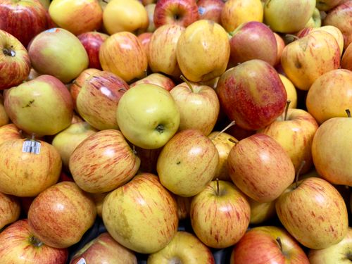 Free A vibrant and colorful display of fresh apples stacked together, perfect for fruit lovers. Stock Photo