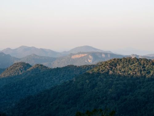 Free A tranquil landscape capturing expansive mountain ranges under a clear sky. Stock Photo