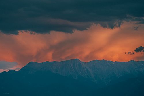 Free Dramatic sunset with vibrant clouds over Denizli's mountainous landscape. Stock Photo