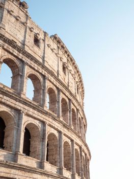 The iconic Colosseum in Rome, Italy, captured beautifully against a clear blue sky.
