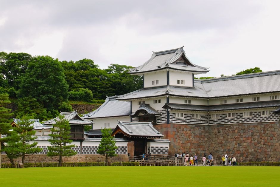 Explore the iconic Kanazawa Castle, a blend of traditional Japanese architecture and lush surroundings.