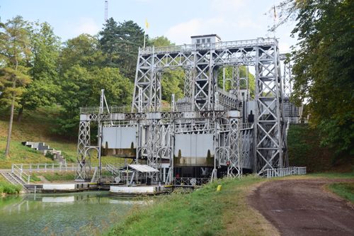 Free An impressive hydraulic boat lift surrounded by lush greenery and trees. Stock Photo