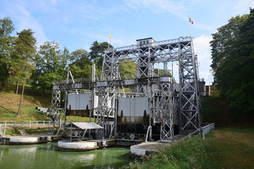 Free A detailed view of the historic boat lift on the Canal du Centre surrounded by lush greenery. Stock Photo