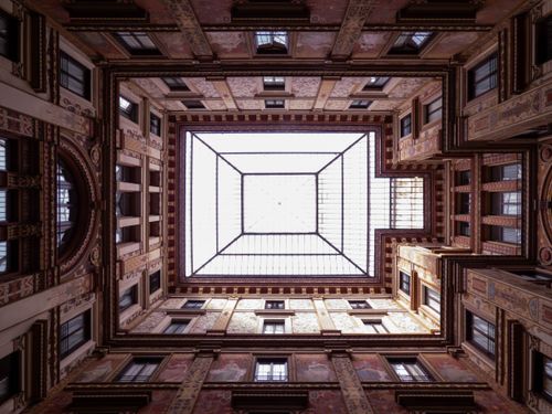 Free Stunning view of an Art Nouveau courtyard ceiling with intricate designs in Rome, Italy. Stock Photo