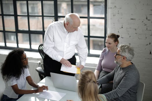 Team of diverse professionals collaborating in a modern office setting.