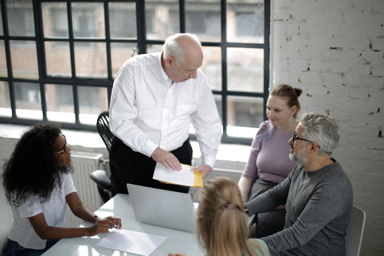 Multiethnic Group Of Colleagues Working Together In Modern Office