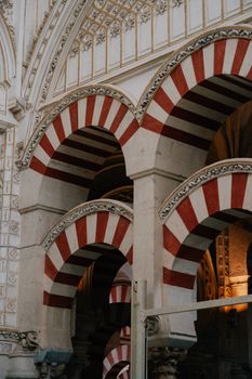 Intricate arches of the Mezquita in Córdoba showcasing Moorish architecture.