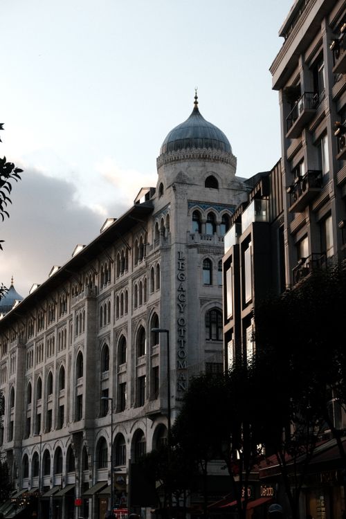 Free A historic Ottoman-style building with a dome at twilight, showcasing classic architecture. Stock Photo