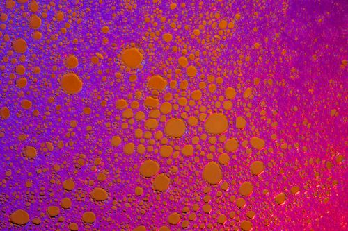 Free Colorful abstract image of soap bubbles in vibrant purple and orange tones, depicting an organic pattern. Stock Photo