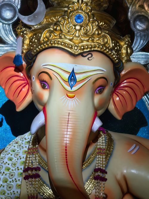 Free Colorful and detailed close-up of Lord Ganesha statue with ornate decorations. Stock Photo