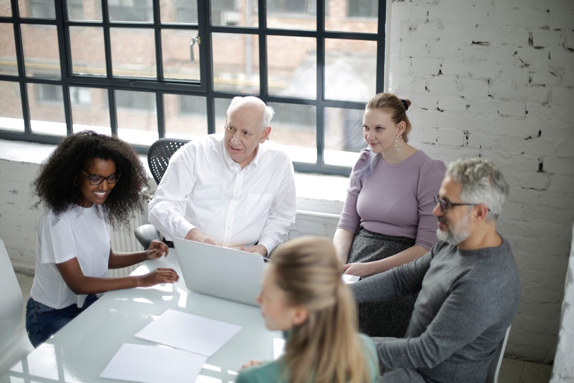 Free People Sitting in a Meeting Stock Photo