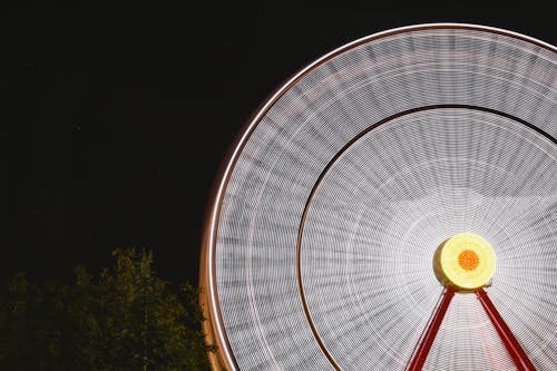 An Illuminated Ferris Wheel During Night Time