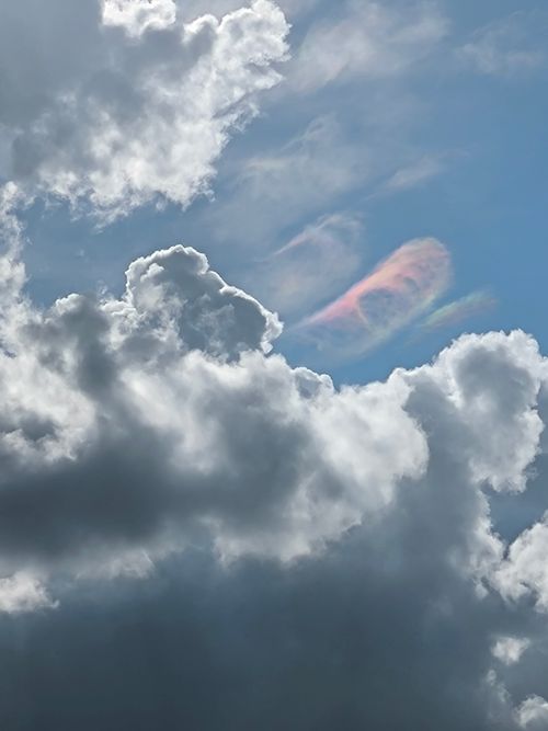 Free Majestic clouds and rare iridescent phenomenon in the sky over Distrito Capital, Venezuela. Stock Photo