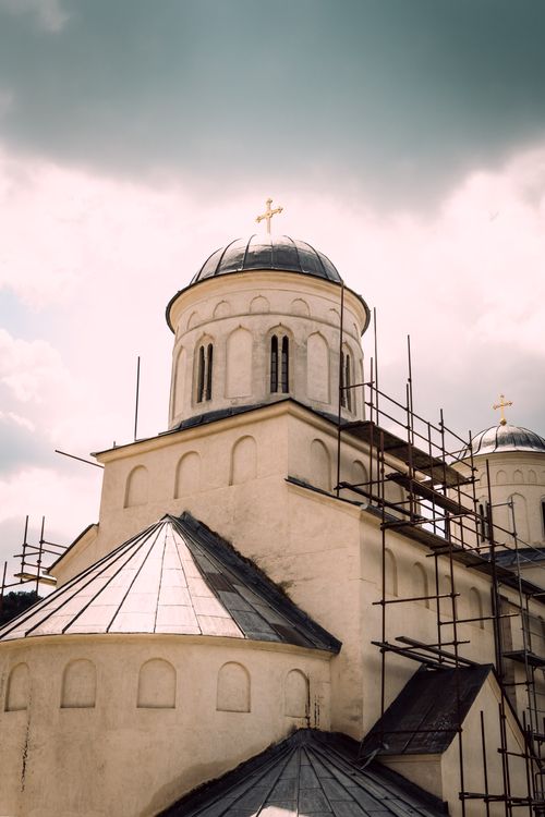 Free A picturesque view of the Mileševo Monastery's architecture undergoing renovation. Stock Photo