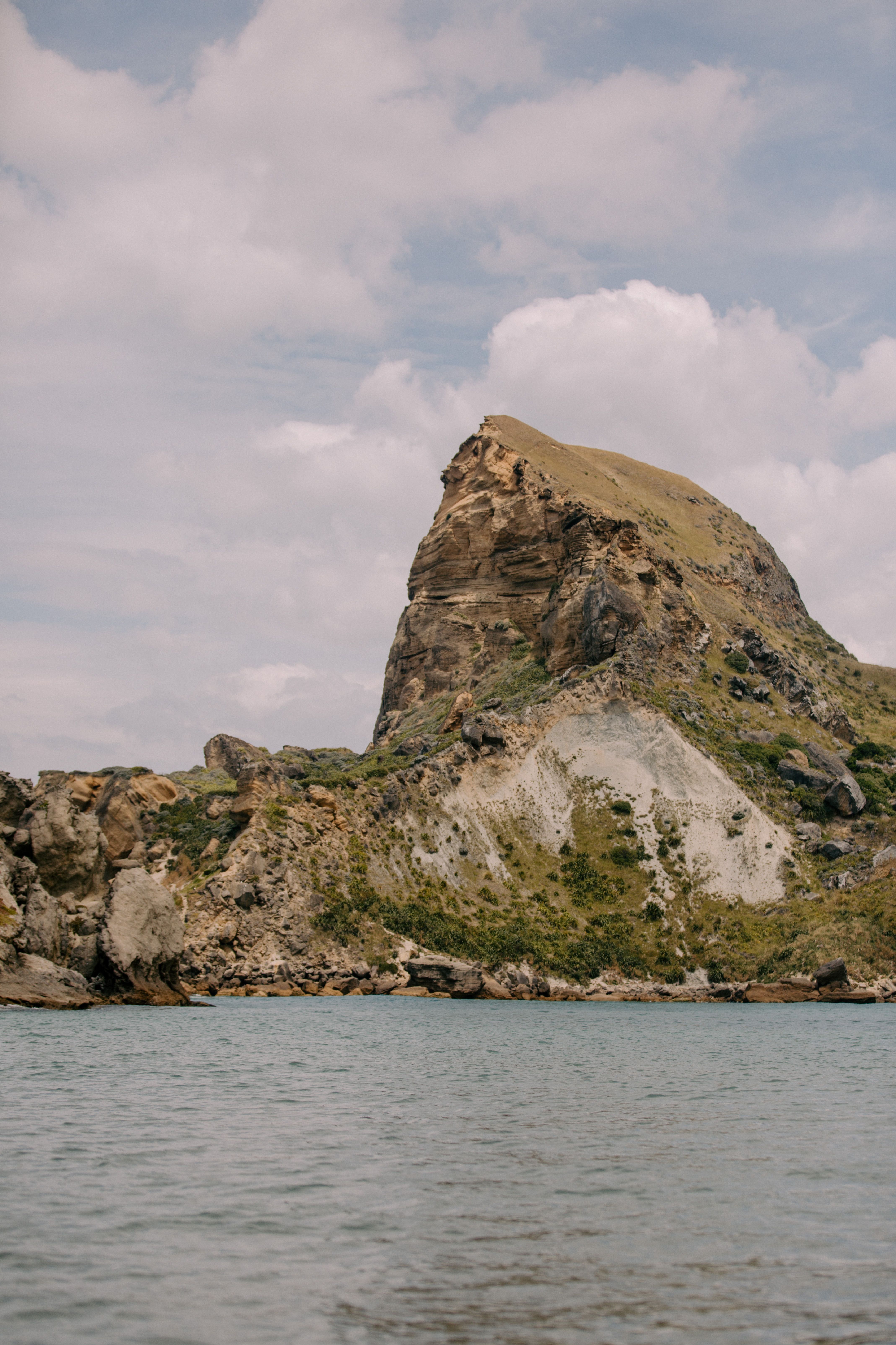 Scenic view of the impressive cliffs at Castlepoint, Wellington Region, New Zealand's rugged coastline.