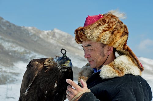 A Man Holding an Eagle