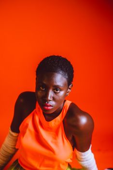 A striking portrait of a young woman in a bright environment, exuding confidence and style.