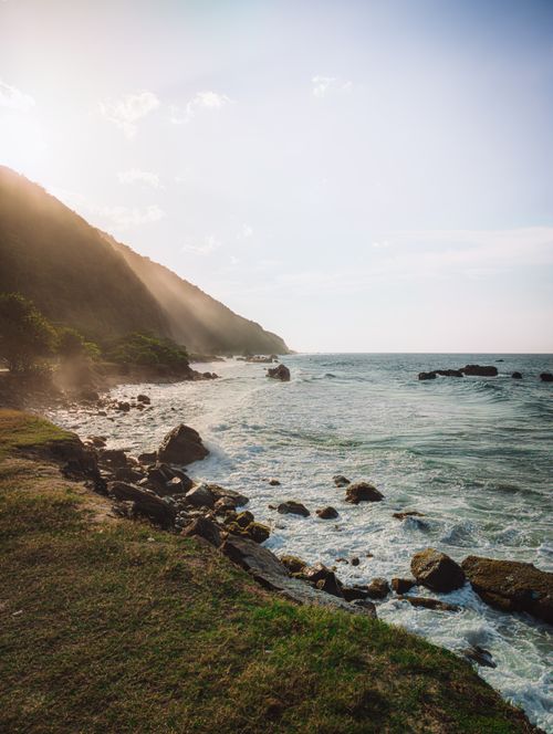 Free Breathtaking coastal scene at sunrise with waves crashing on rocky shore in Caracas, Venezuela. Stock Photo
