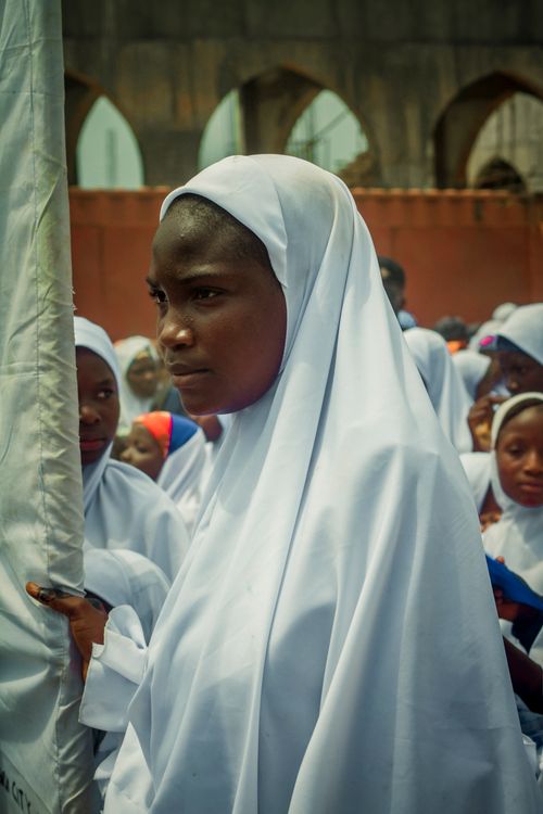 Free Group of women in traditional white hijabs during a cultural event in Zaria, Nigeria. Stock Photo
