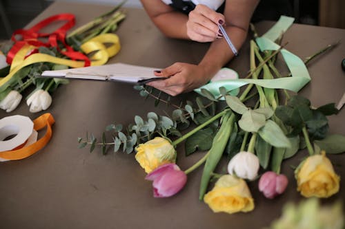 A Variety Of Flowers On Table