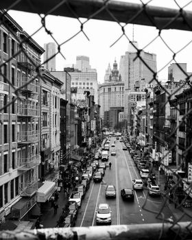 Monochrome urban street scene showcasing New York City's architectural landscape.