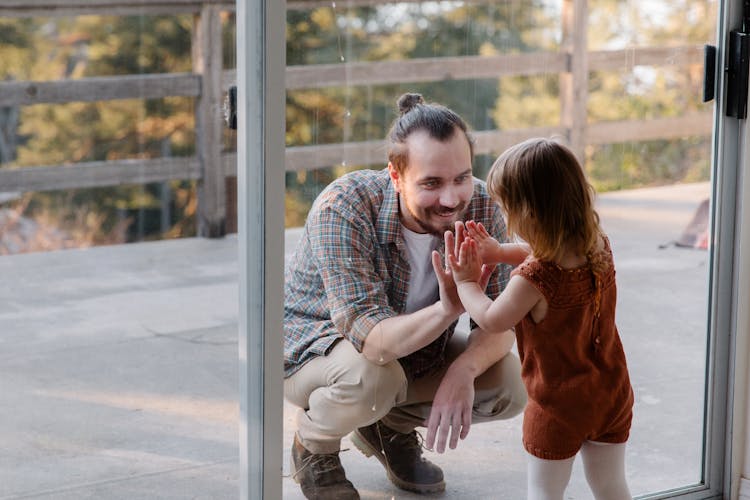 Little Daughter And Father Having Fun Together