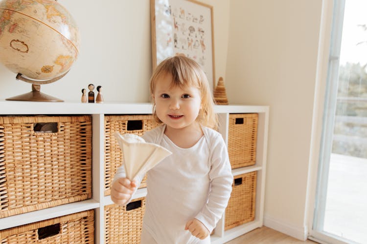 Cute Little Girl Playing With Toy