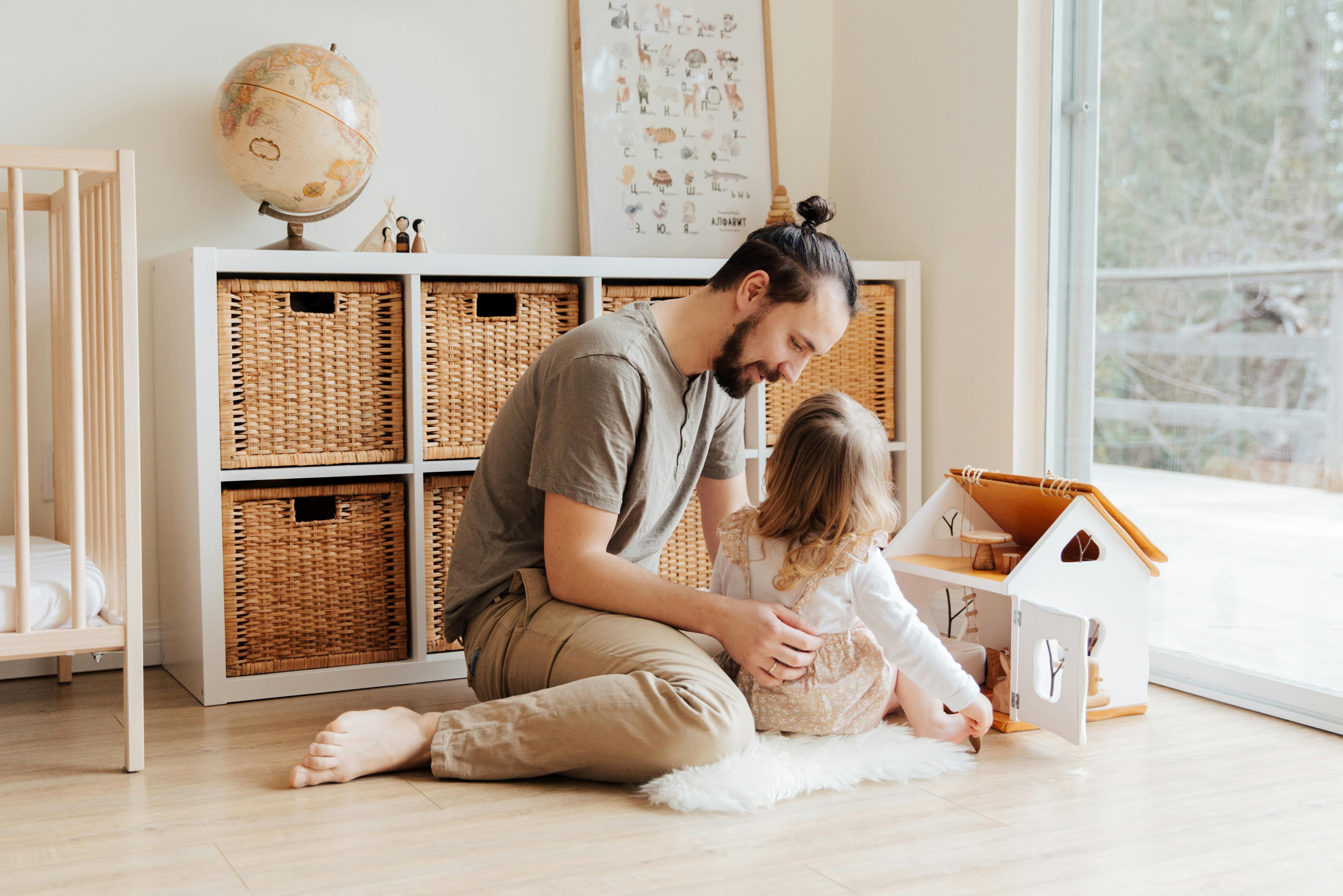 photo of man holding child