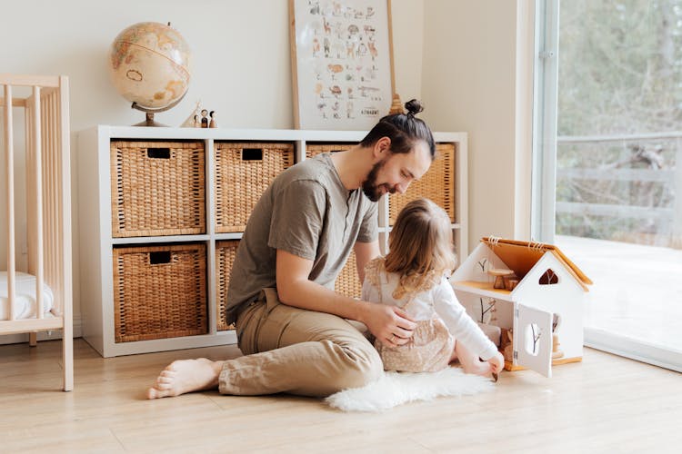 Photo Of Man Holding Child