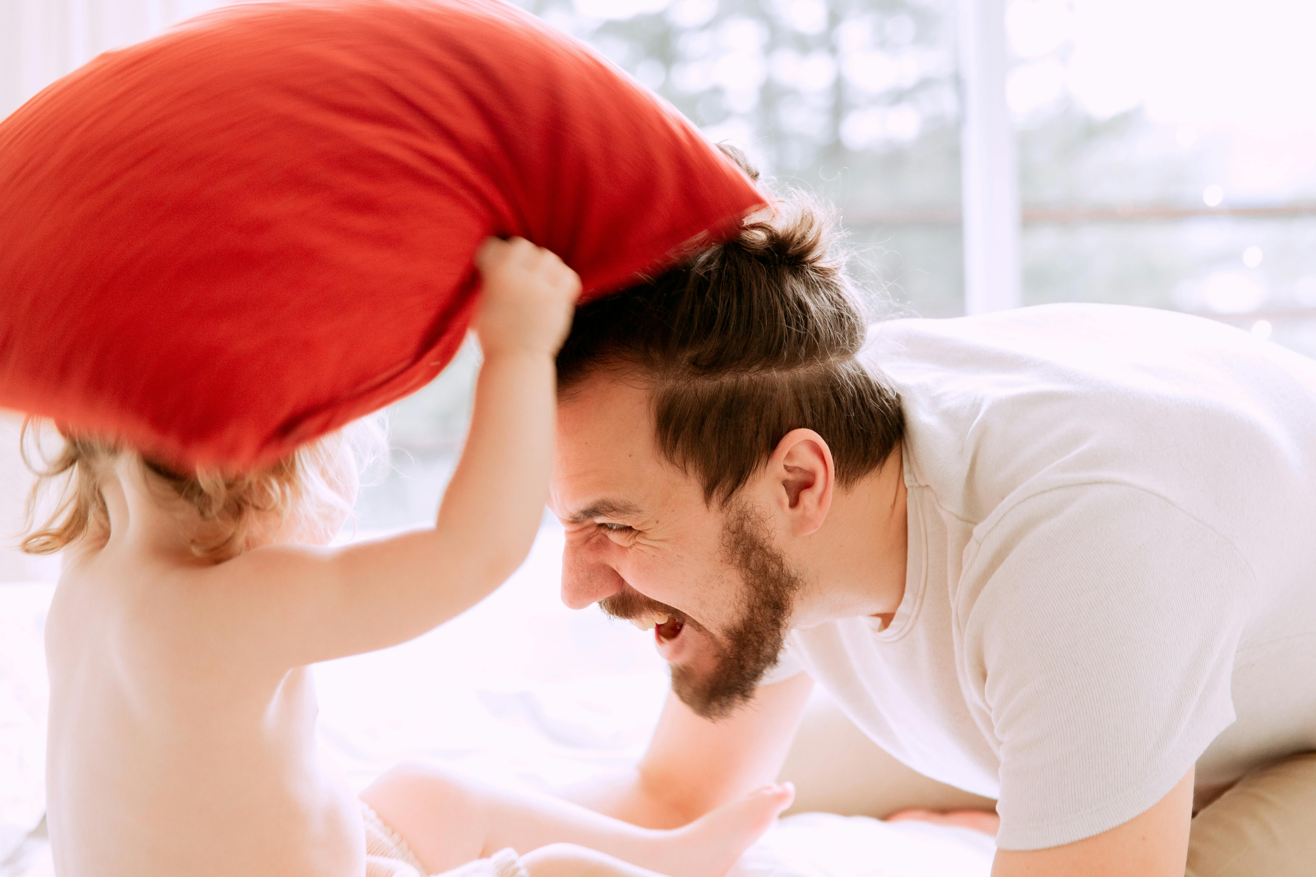 photo of man playing with child