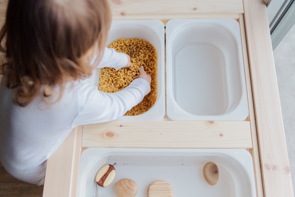 Free Photo Of Child Playing With Macaroni Pasta Stock Photo