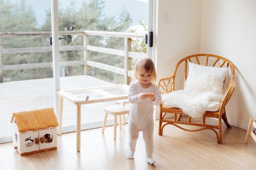 Free Girl Playing In The Living Room Stock Photo