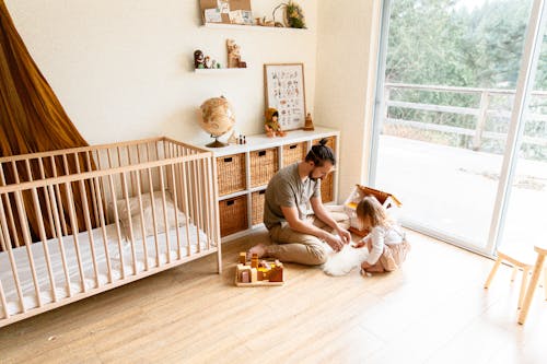 Photo Of Man Playing With Child