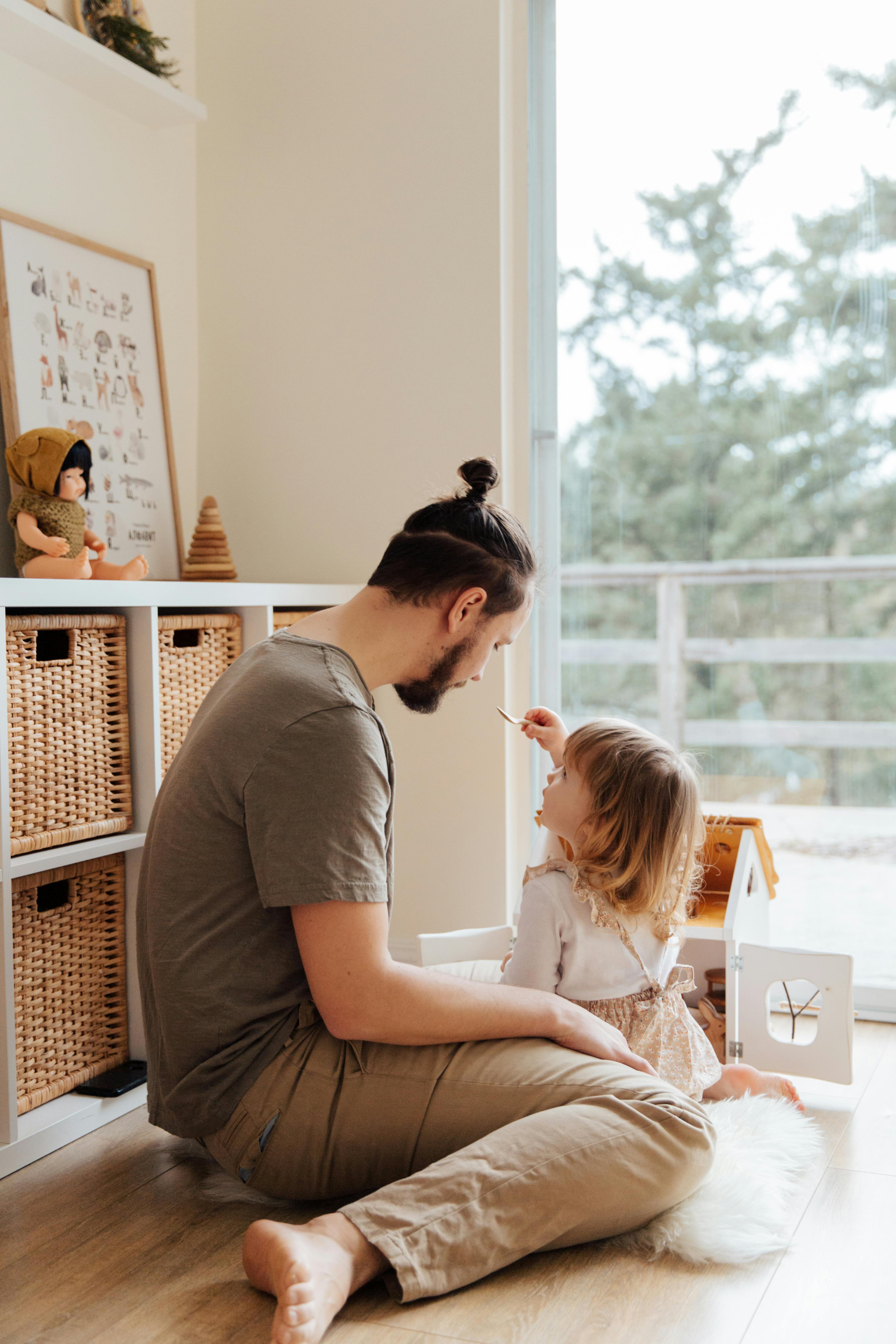 photo of man playing with child