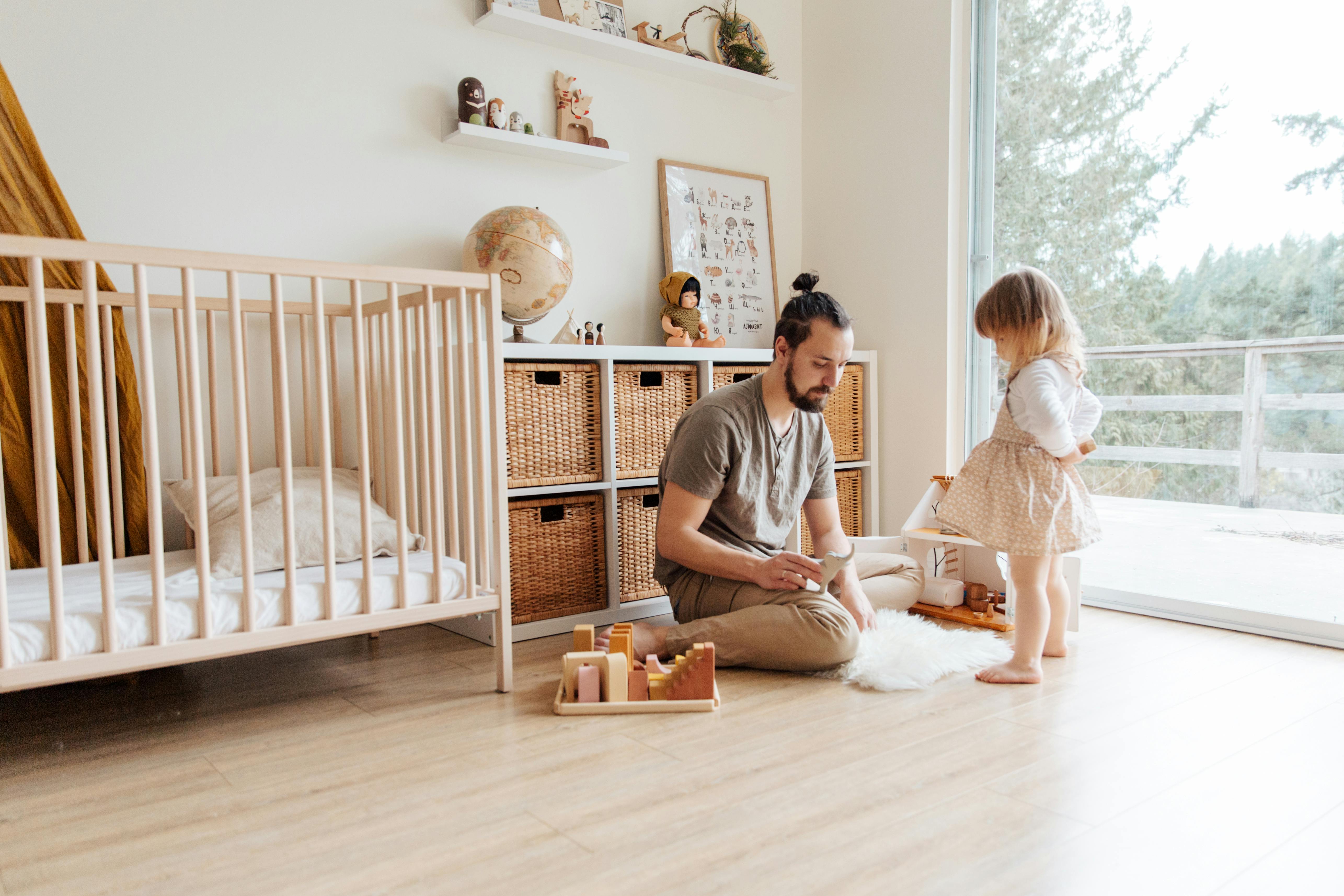 photo of man sitting on wooden floor