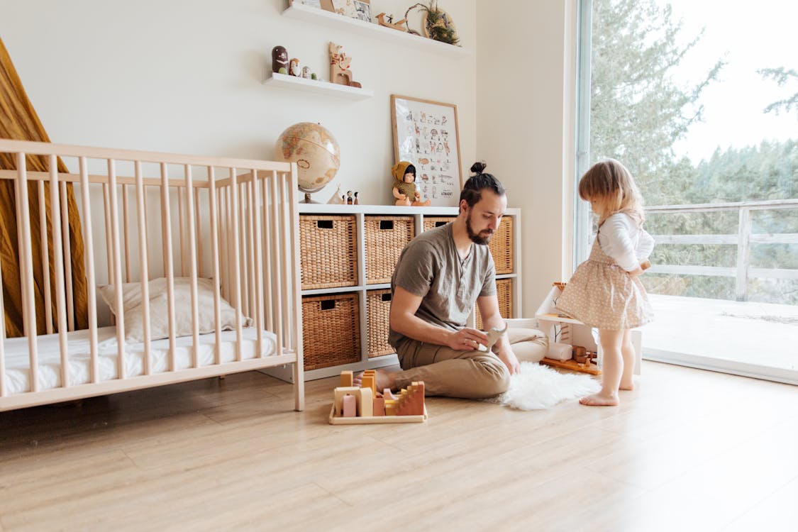 Free Photo Of Man Sitting On Wooden Floor Stock Photo