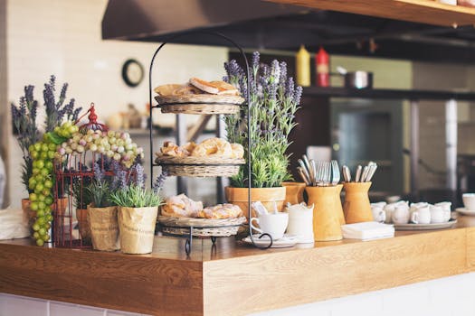 Inviting café counter with delicious pastries and vibrant plants creating a cozy atmosphere.