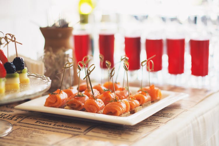 Salmon Canapes And Fruits On White Tray