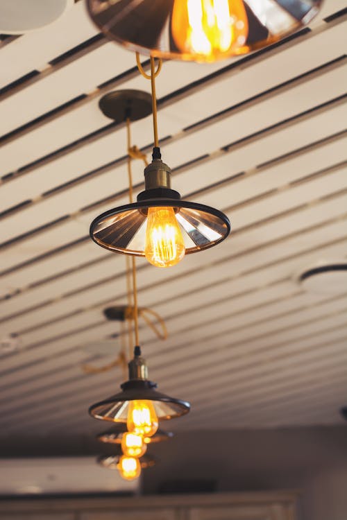 Brown Pendant Lamp Turned on in Room