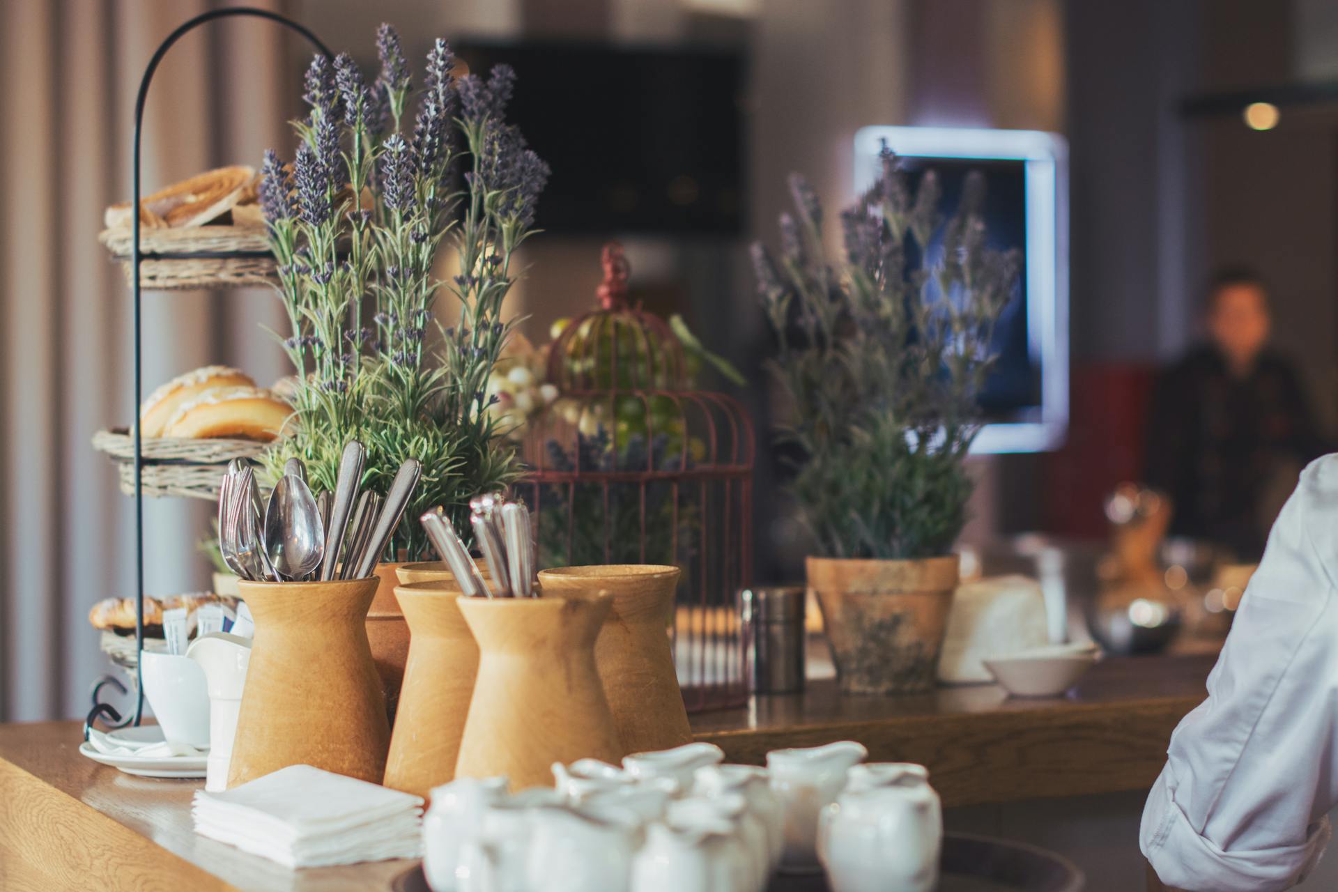 Stylish buffet arrangement featuring lavender in clay pots, ready for dining experience.