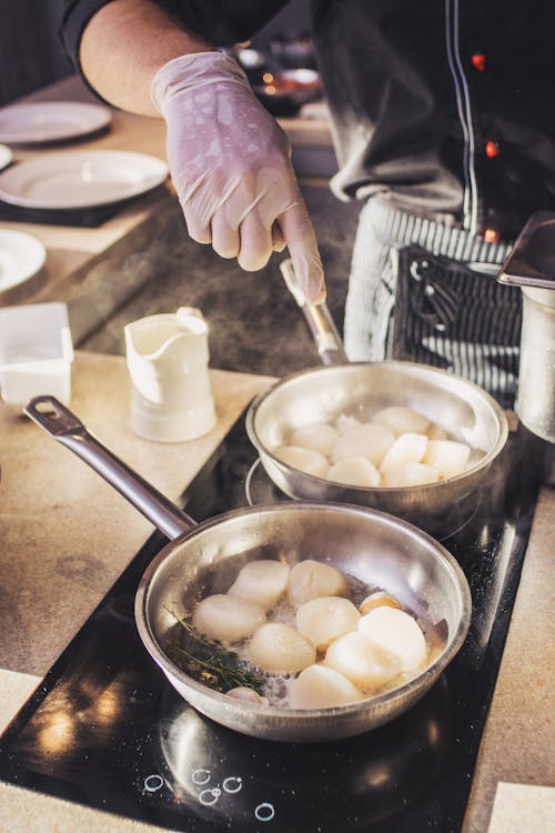 Free Person Holding Stainless Steel Cooking Pot With Food Stock Photo