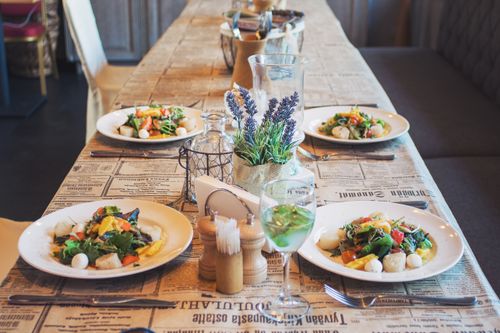 Free A beautifully arranged table with fresh salads, perfect for a restaurant or café setting. Stock Photo