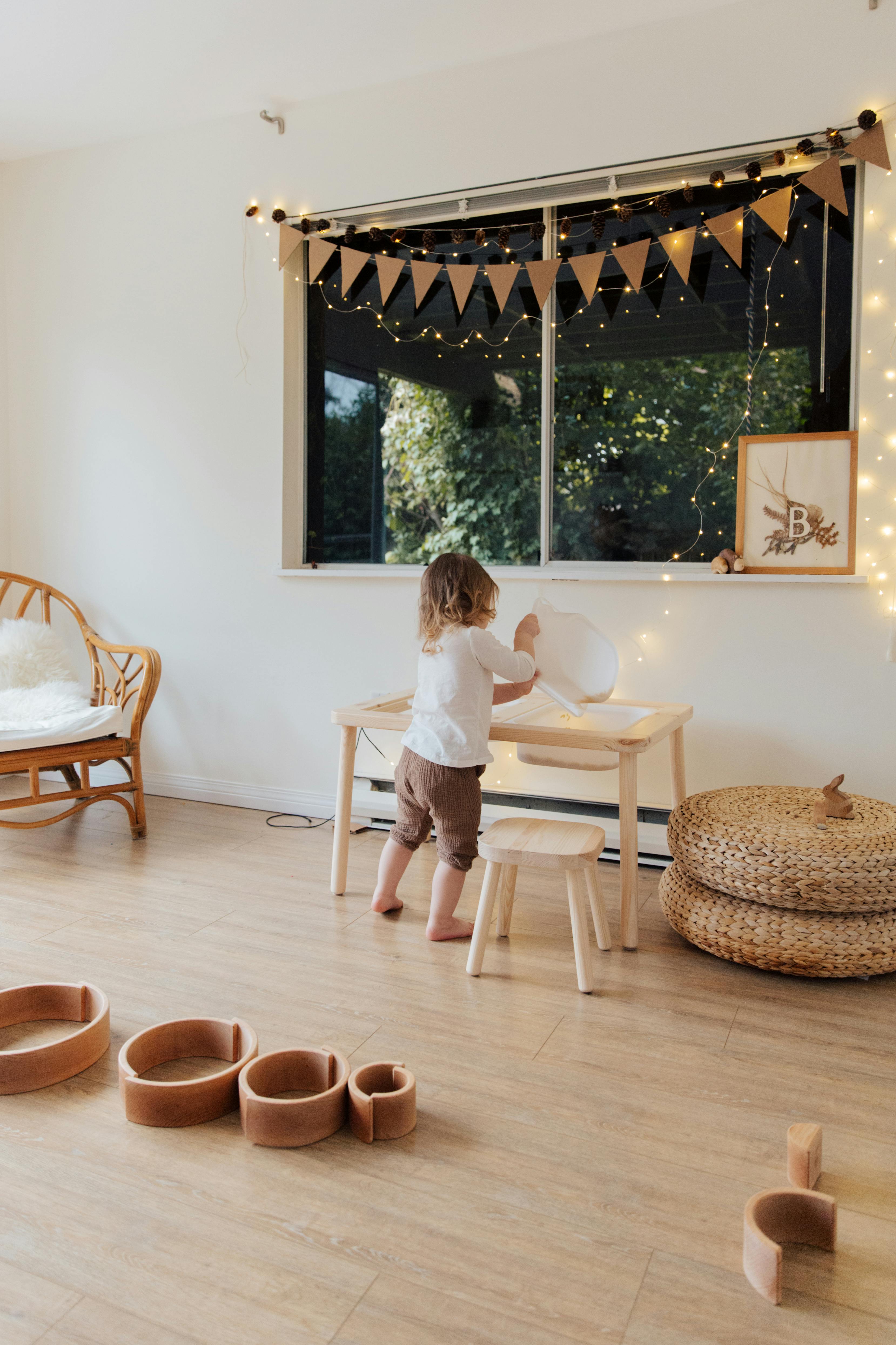 photo of child near wooden table